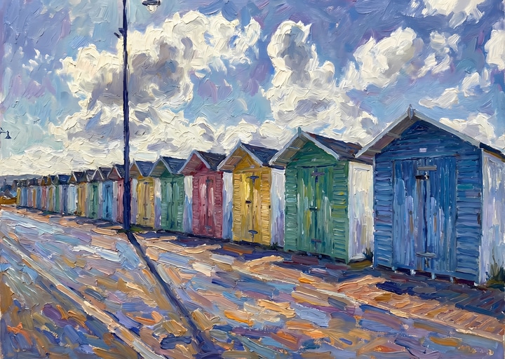 Colourful beach huts arranged along Eastbourne seafront